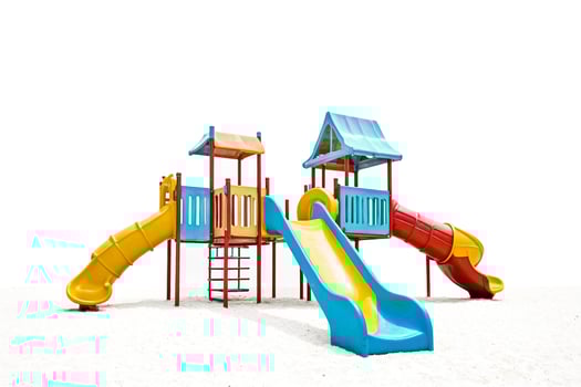 Colorful Playground Slide on White Sand photo