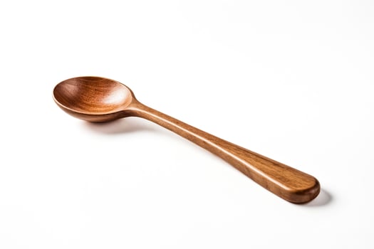 Wooden spoon isolated on white background photo