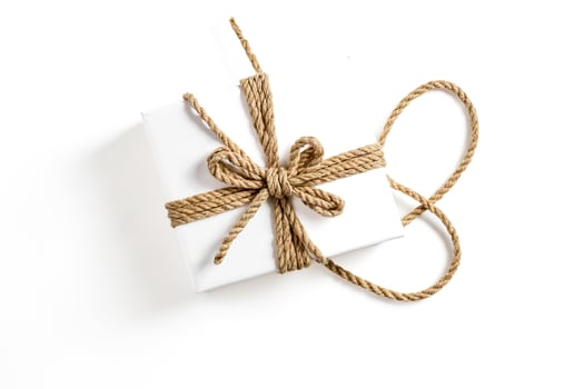 White gift box with natural rope bow photo