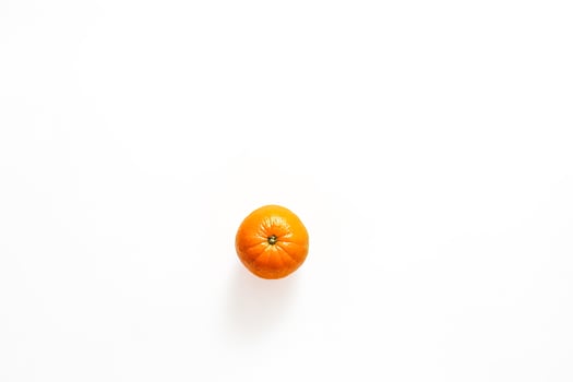 Single Mandarin Orange on White Background photo