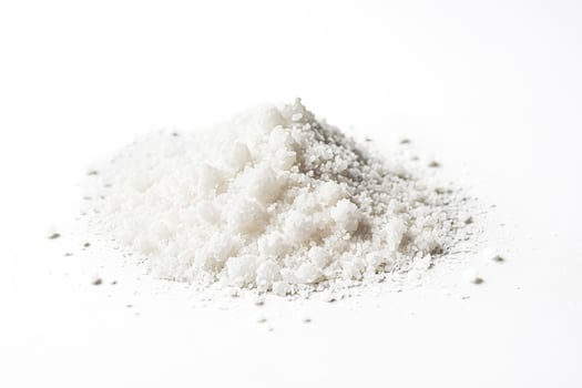 White salt crystals on white background photo