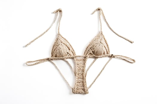 Beige crochet bikini top isolated on white background photo