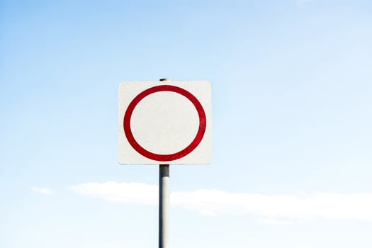 Speed Limit Sign 35 MPH Against Blue Sky photo