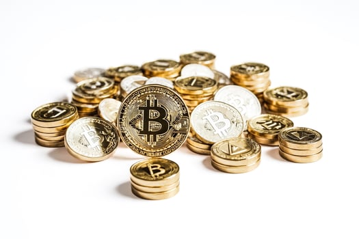 Bitcoin and Cryptocurrency Coins on White Background photo