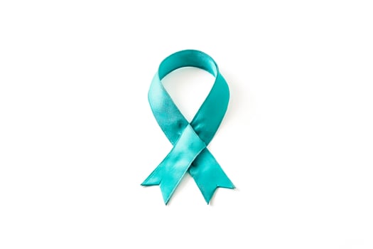 Teal Awareness Ribbon on White Background photo