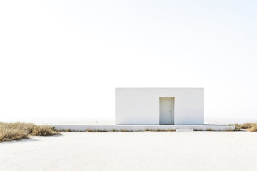 Minimalist white house on a white sandy beach photo