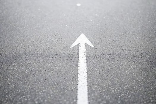 White Arrow on Grey Asphalt Road photo