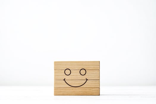 Wooden block with a smiley face photo
