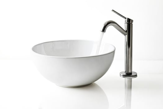 Modern Bathroom Sink with Chrome Faucet and Running Water photo
