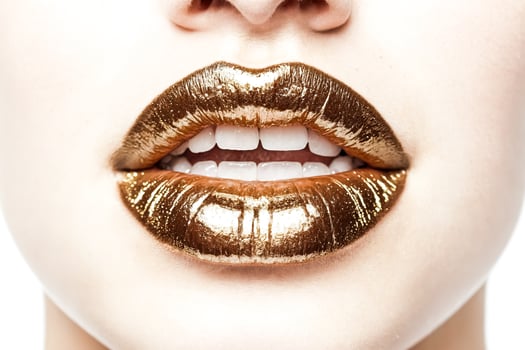 Close-up of Golden Lips with Open Mouth photo