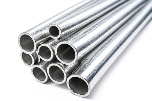 Stack of Shiny Metal Pipes photo