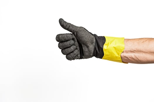 Hand in a work glove giving a thumbs up photo