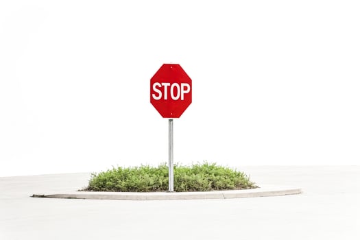 Stop Sign In Front of a White Background photo