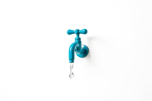 Blue Faucet With Water Droplet On White Background photo