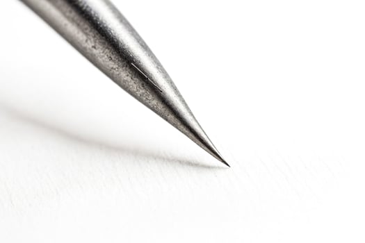 Closeup of a sharp metal needle point photo