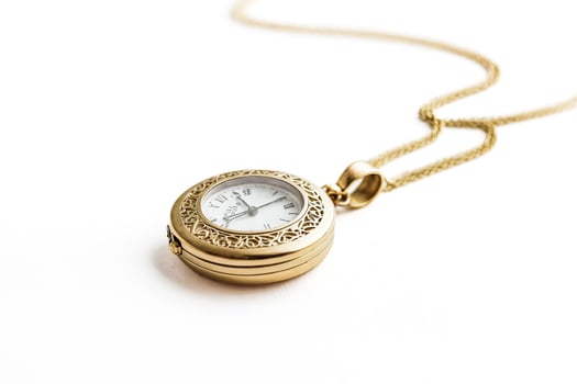 Gold Pocket Watch with Chain on White Background photo