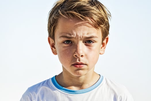 Close-up Portrait of a Serious Young Boy photo