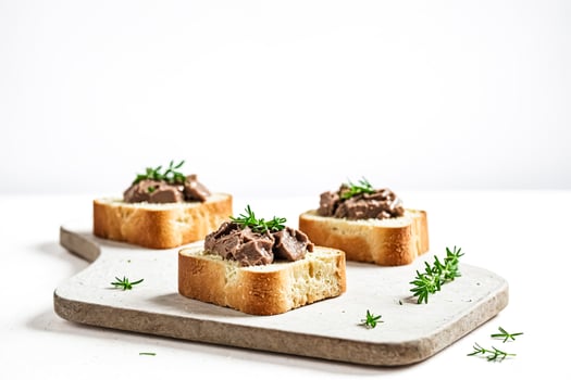Liver pate sandwiches on bread with herbs photo