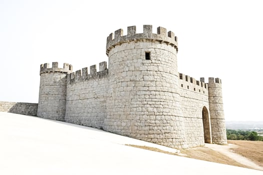 Stone Castle Tower with Archway on White Background photo