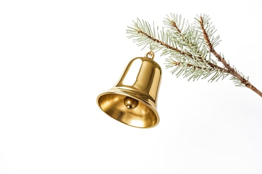 Golden Bell Hanging from Pine Branch Isolated on White Background photo