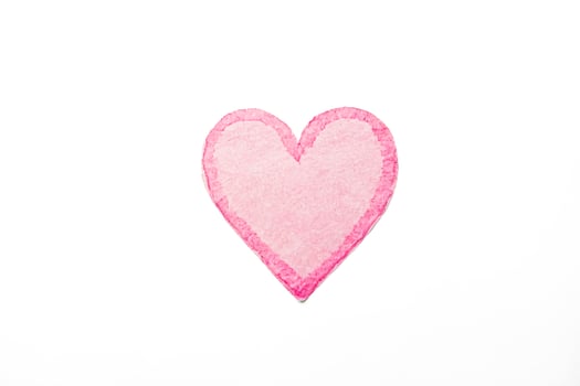 Pink Heart Paper Cutout on White Background photo