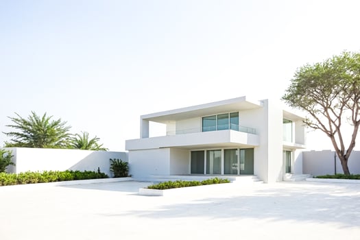 Modern Minimalist White House with Green Bushes and Trees photo
