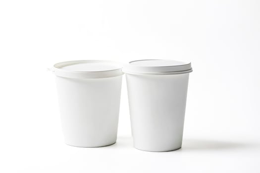 Two White Plastic Cups With Lids photo