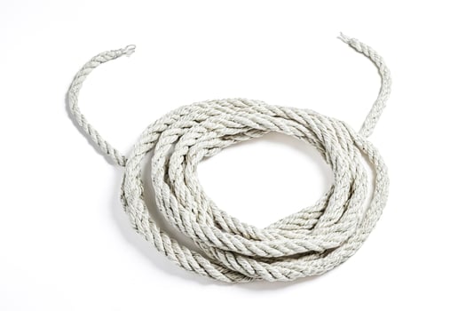 White Rope Coiled on White Background photo