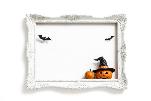 Halloween pumpkins with witch hat in white frame photo