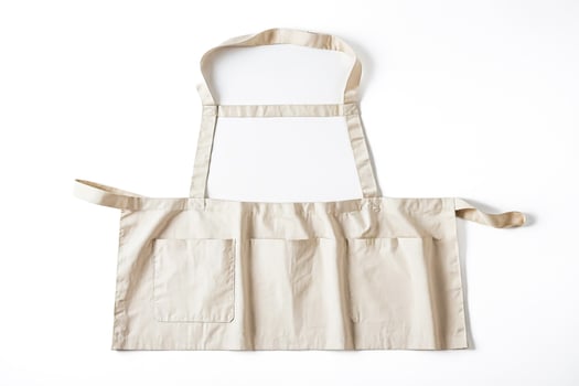 Beige Apron with Pockets Isolated on White Background photo