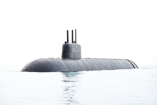 Submarine surfacing in the ocean photo