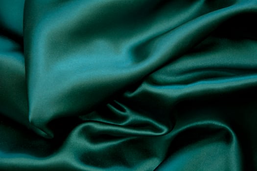 A dark green satin fabric photo