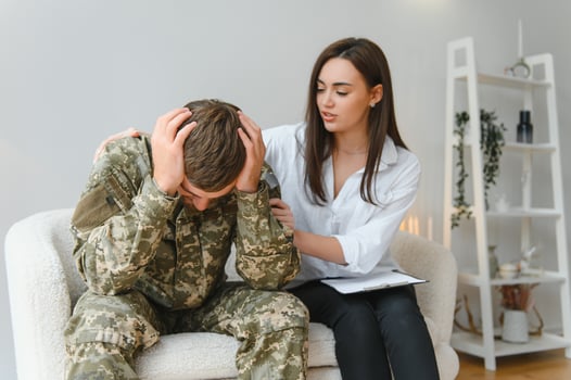 Psychologist supporting military officer in office photo