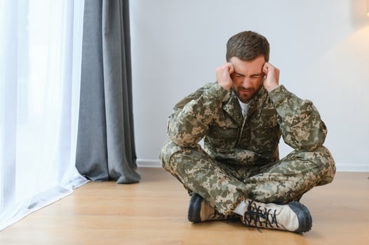 Portrait of middle aged sad, desperate military man. PTSD concept. Horizontal shot photo