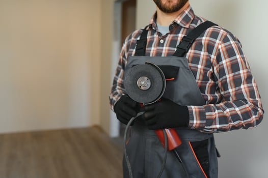 Portrait of a construction worker or repairman in the house photo
