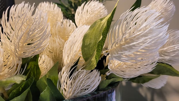 Decorative artificial white flowers similar to natural ones photo