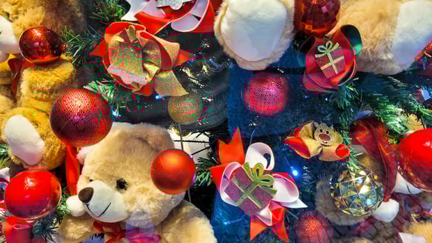 Christmas tree decorated with light and colored balls with red bows photo