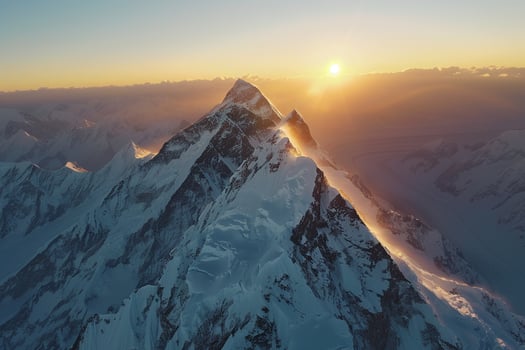 Majestic Sunlight Illuminating the Peaks of SnowCapped Mountains Aerial nature background photo