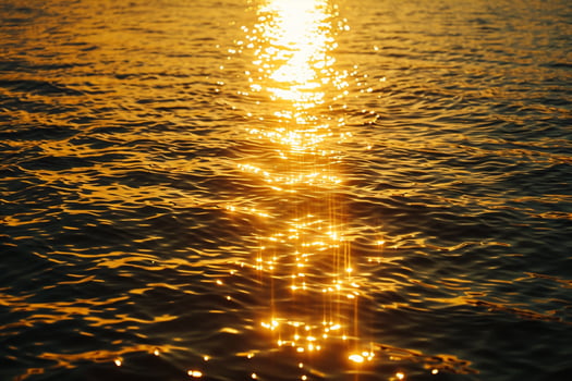 Seascape Sunlight creating shimmering path on the surface of the sea during sunset  nature background photo