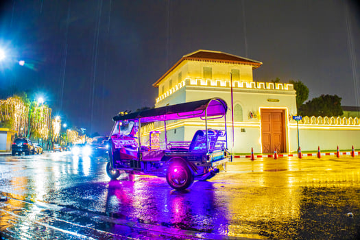 In Bangko a purple-lit Tuk Tuk in front of the fortress. photo