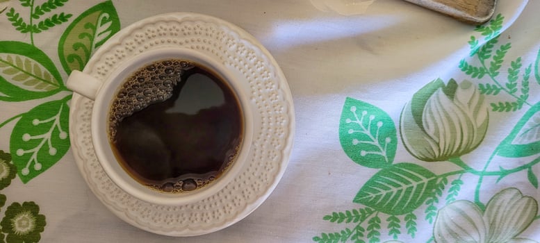 white cup of coffee for breakfast photo