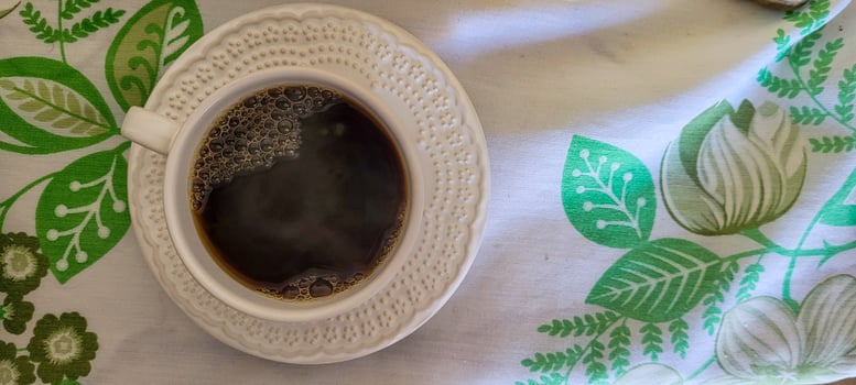 white cup of coffee for breakfast photo