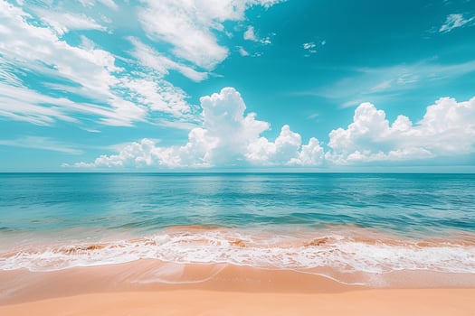 Gorgeous Beach with Golden Sand and Turquoise Waters Under Clear Blue Sky with Fluffy White Clouds   nature background photo