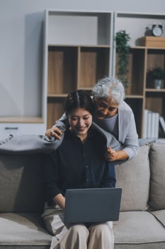 Asian elderly women and friend using social media and living room. streaming, happiness and conversation at a house with old people together photo