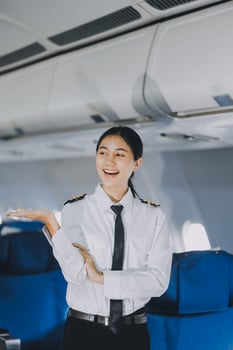 Portrait of a trained airplane captain in uniform preparing to fly, event planning in airplane. photo