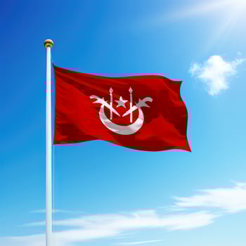 Waving flag of Kelantan is a state of Malaysia on flagpole photo
