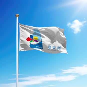Waving flag of Taitung County is a region of Taiwan on flagpole photo