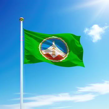 Waving flag of Kinmen County is a region of Taiwan on flagpole photo