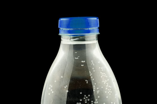 Plastic bottle with water close-up photo