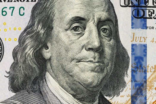 100 dollars Benjamin Franklin close-up photo